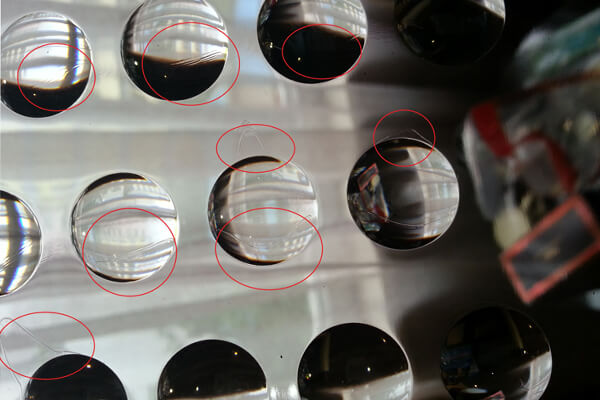 Defects in injection molding LED lenses